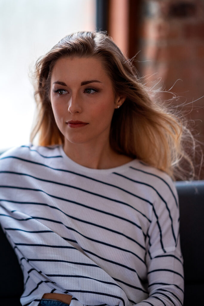 Ashley in white sweater 85mm portrait looking left