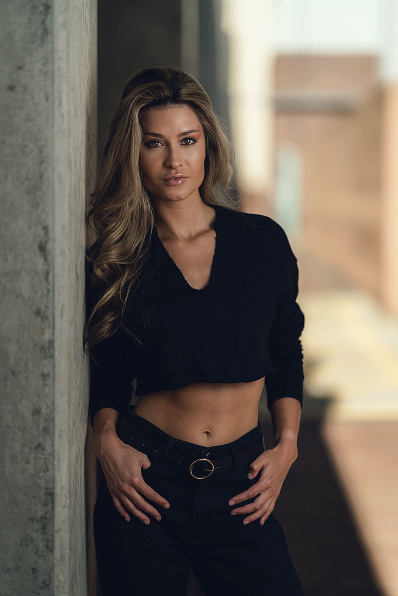 Sony 85mm GMaster Madison leaning against wall